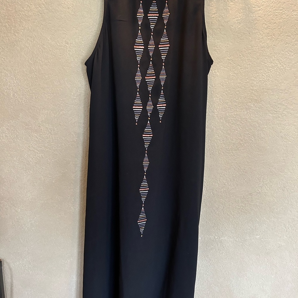 Black halter dress with metallic accents. Above the knee. Never worn.